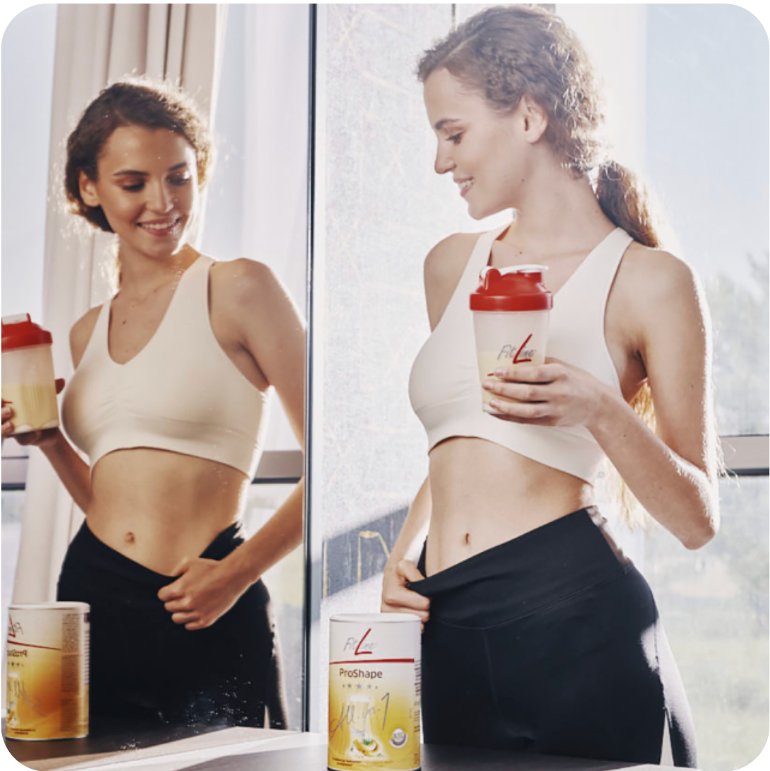 mujer feliz al ver reducción en su abdomen por utilizar los productos de control de peso fitline